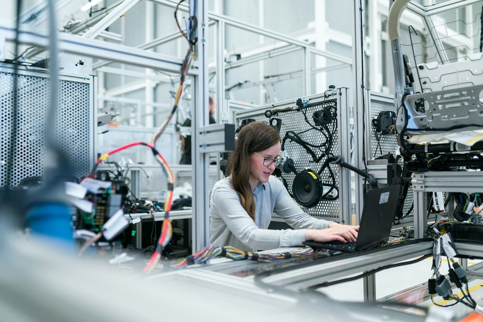 An engineer working with MES data on the production line